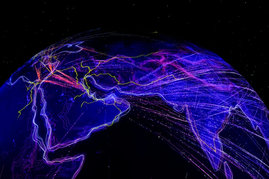 Efficient shipping with ShipStation's AI: Globe with lines indicating connected shipping routes.