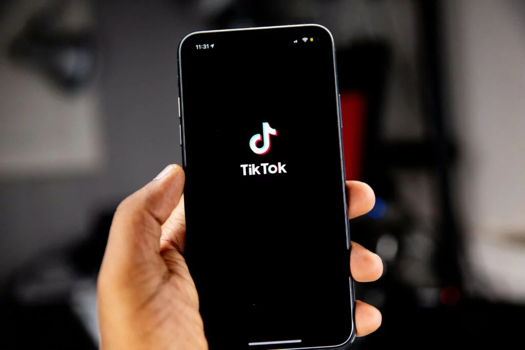 A phone screen displaying the opening of TikTok, a popular social media platform for short-form video content.