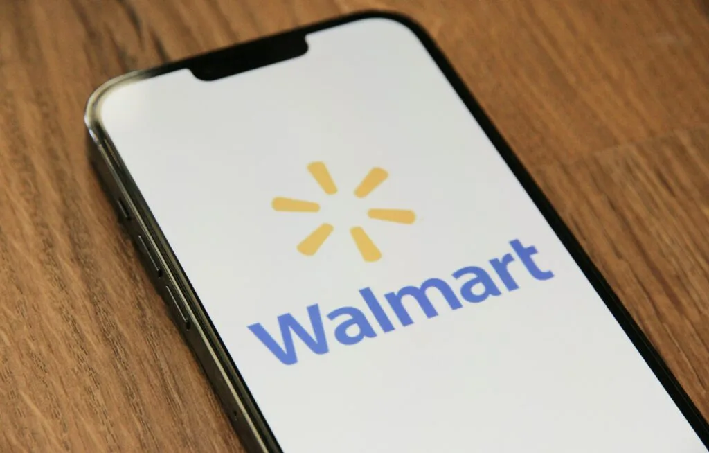 A smartphone featuring the Walmart app logo prominently displayed on the screen. This image signifies the intersection of TikTok eCommerce marketing with retail innovation, illustrating how major retailers are adapting to new consumer engagement strategies in the digital marketplace.