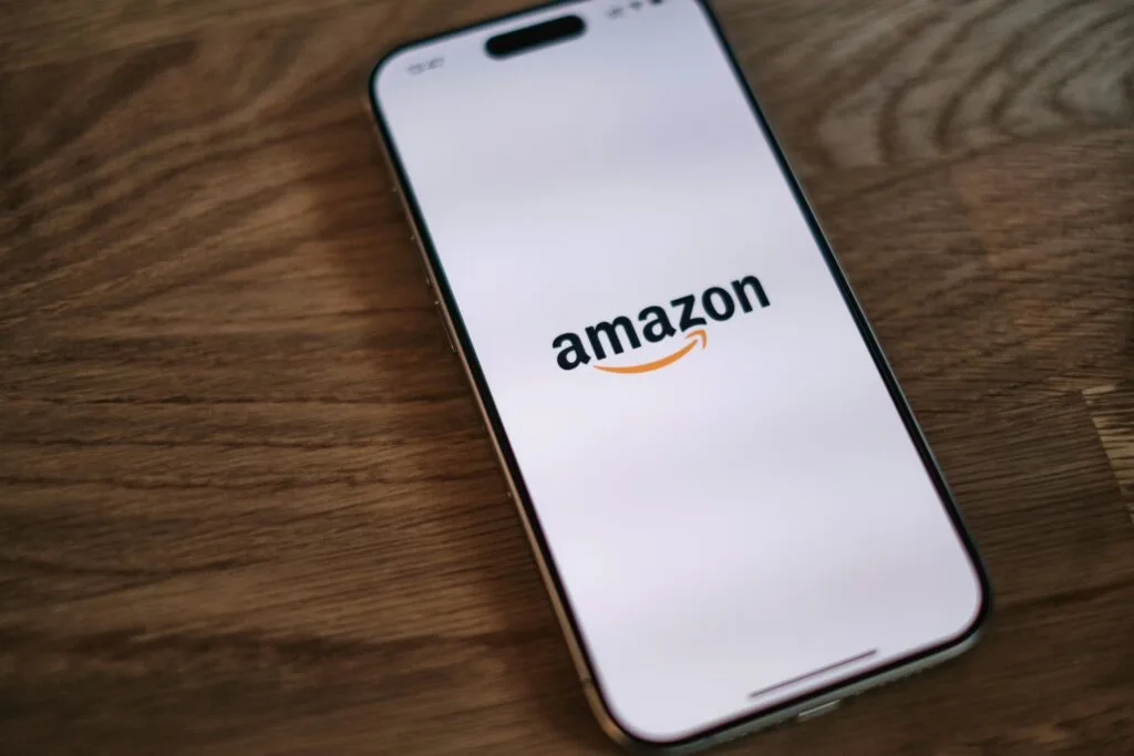 A phone with the Amazon logo on the screen, symbolizing important Amazon FBA updates and the latest eCommerce changes shaping the industry.