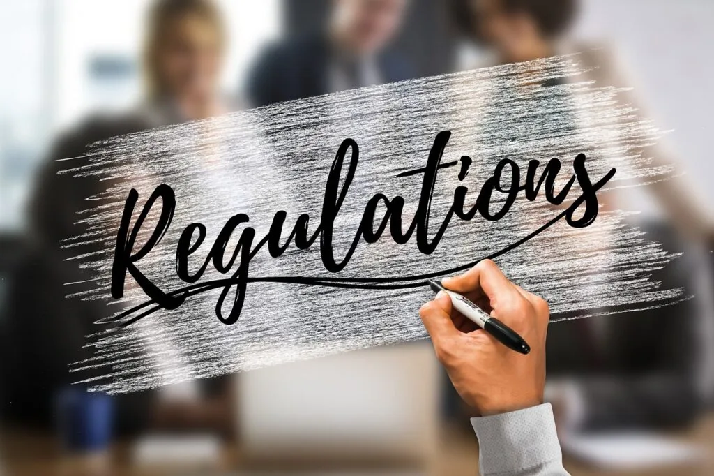 Regulations text over a blurred office background, emphasizing key insights into commerce regulations and emerging trends shaping the digital eCommerce landscape.