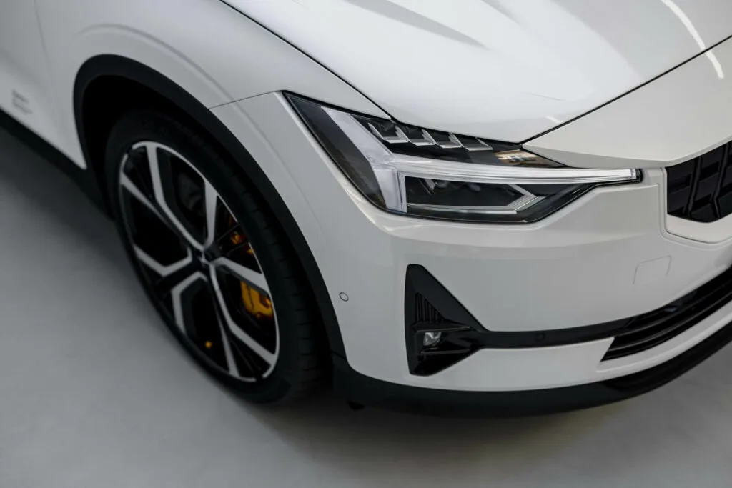 Close-up of a car's headlight and wheels, symbolizing Amazon's innovative strides in the automotive industry and its influence on eCommerce advancements.