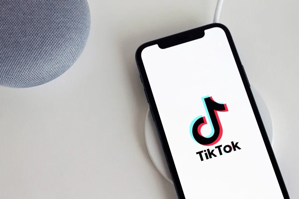 Mobile phone displaying the TikTok logo, highlighting the growing prominence of TikTok Shop for eCommerce marketers during holiday sales.