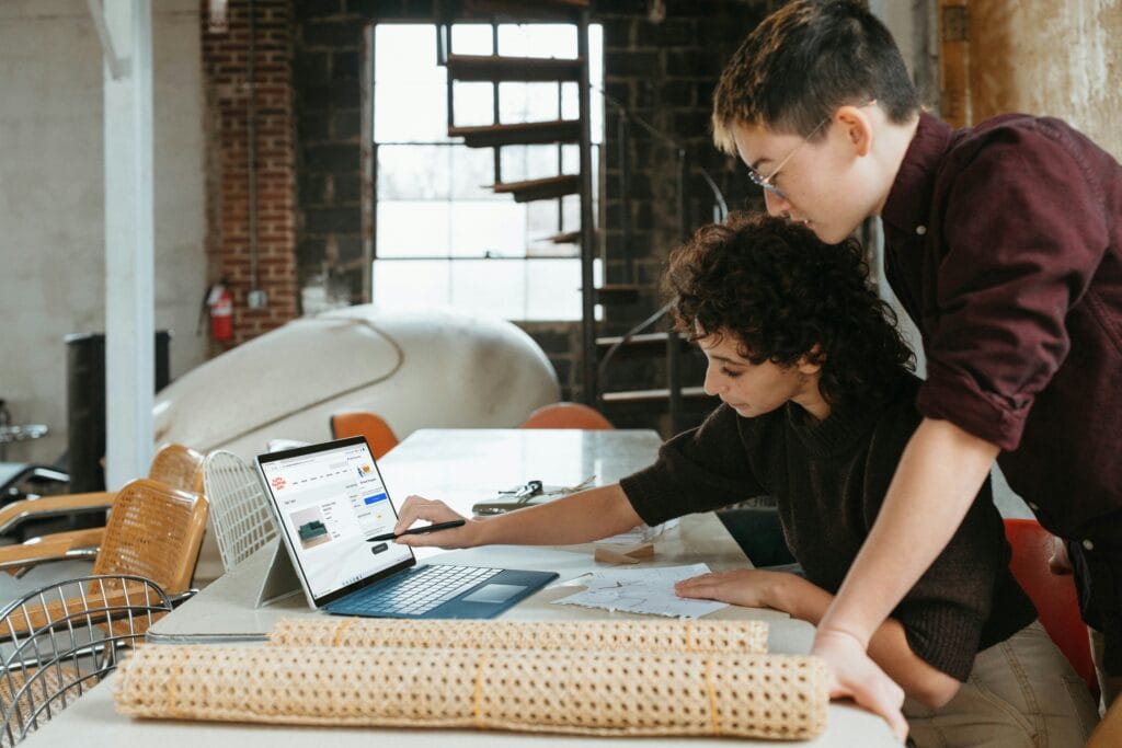 Image of a small business using AI innovations in eCommerce and how they may be affected in the current economic landscape