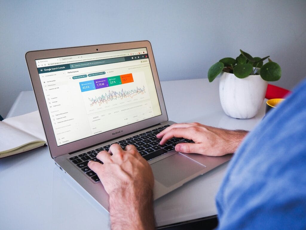 Image of person evaluating data to make informed decisions in regards to email upsell tactics