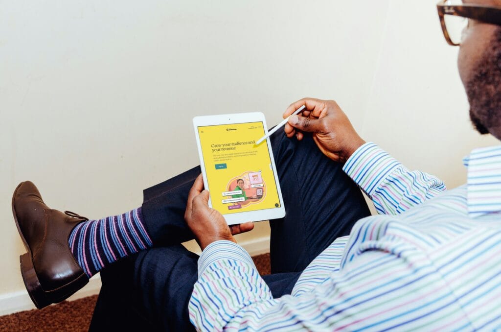 Person sitting on chair working on customer segmentation through Mailchimp