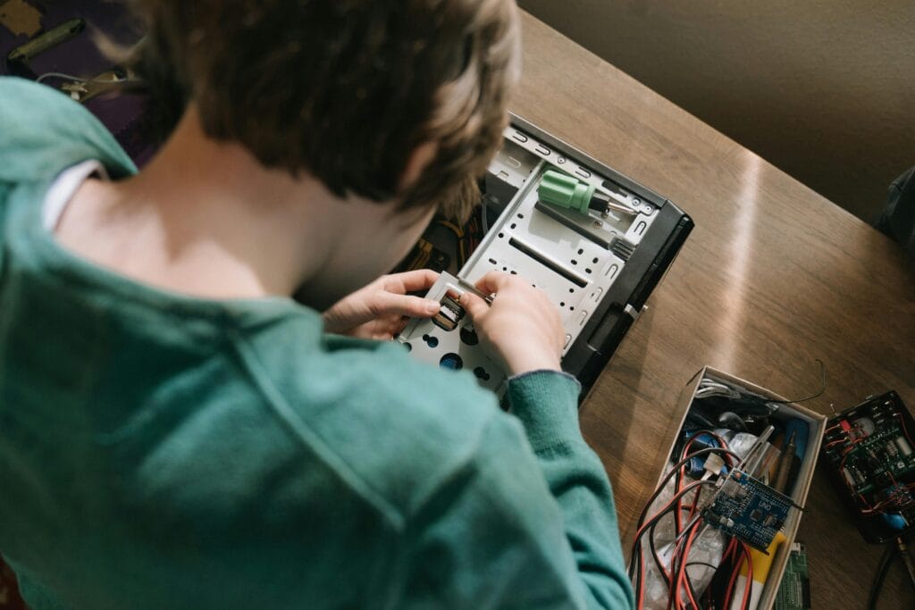 Image of person working on computer's hardware, showcasing GPU power as the heart of Predictive Personalization in eCommerce