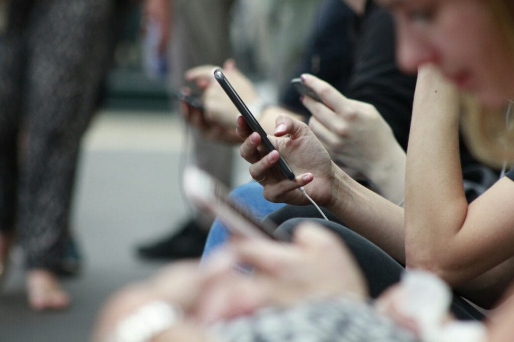 Group of people scrolling through dynamic content on their phone