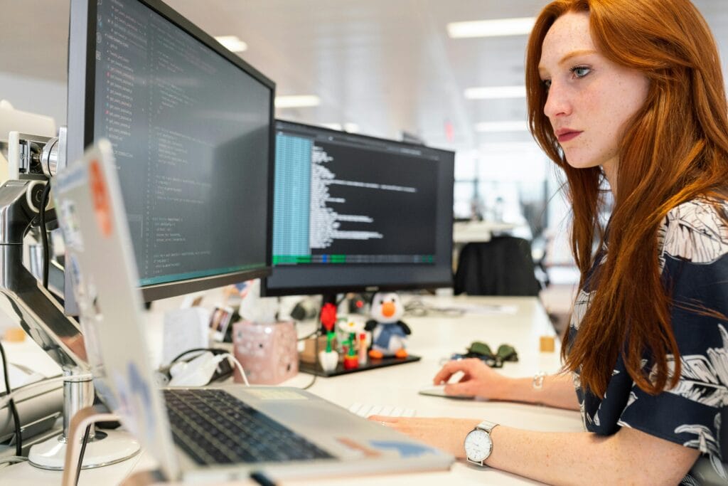 Woman working on Voice of the Customer Initiatives to implement in their new campaign