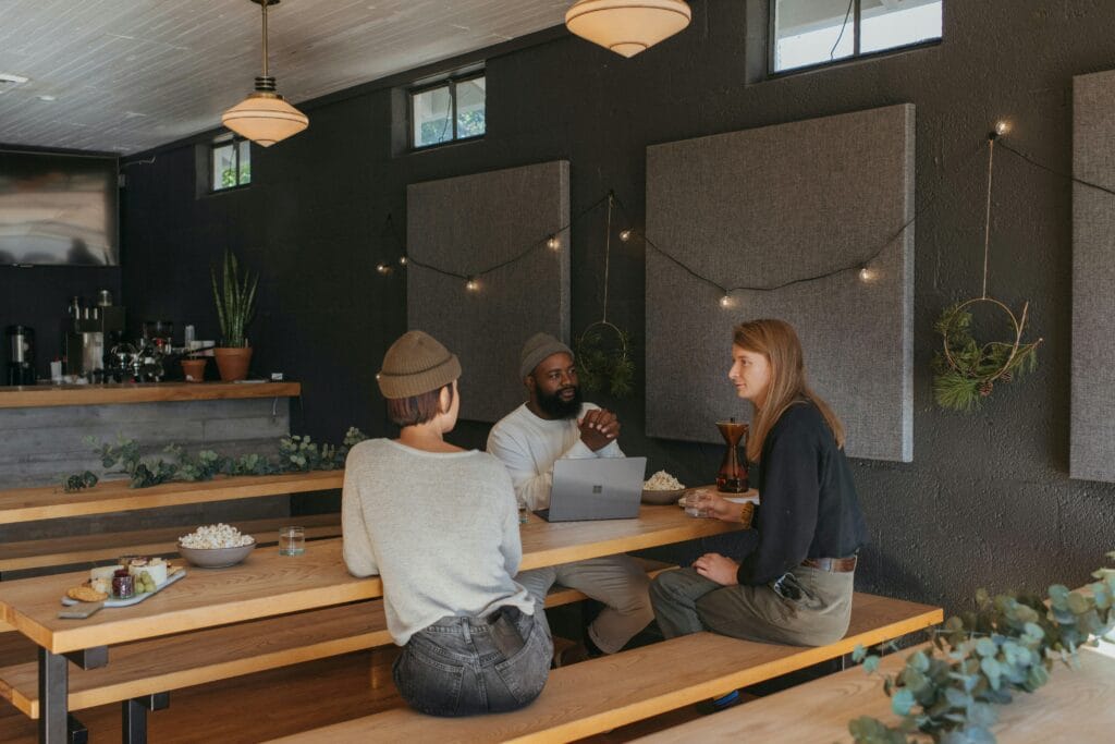 Team of developer, PM, and designer discussing new ways to improve lead nurturing