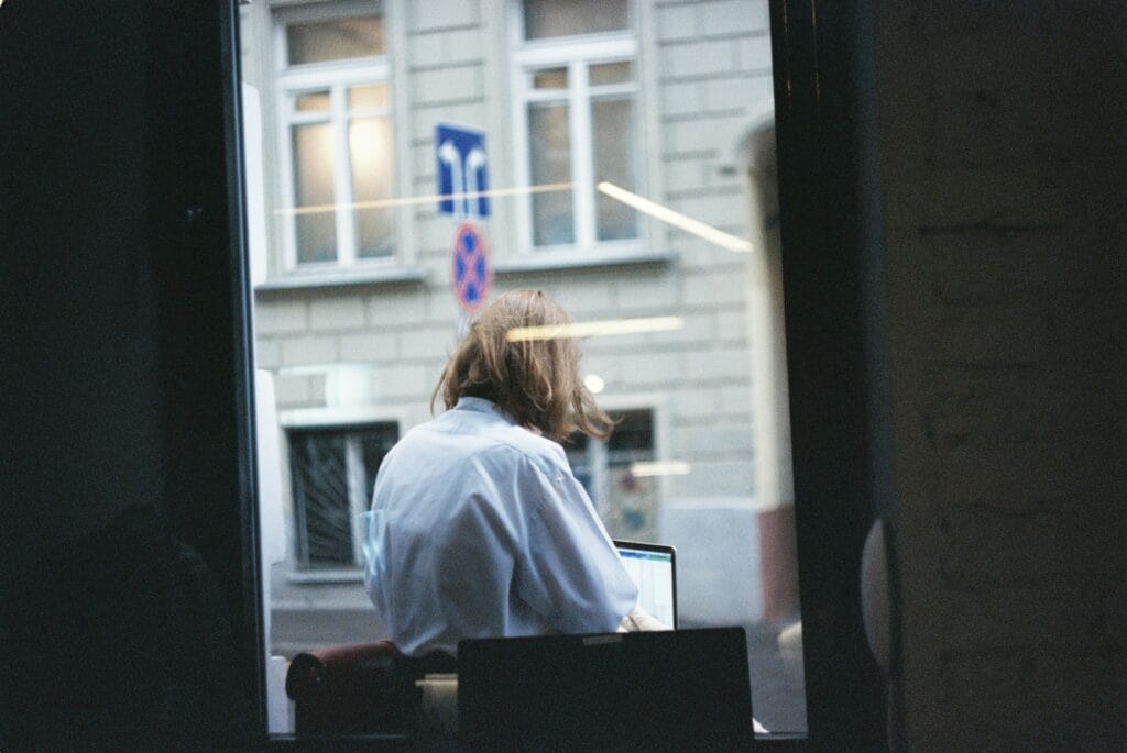 Person working on their computer analyzing Shopify Growth 2025 and More Insights