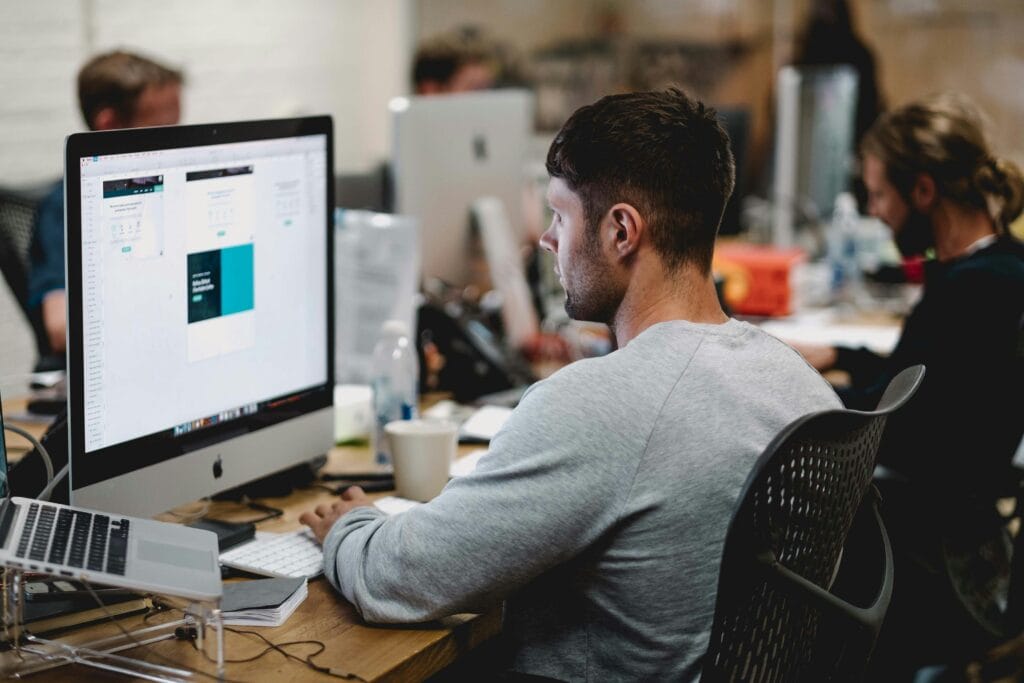 Designer working for an agency researching Shopify Growth 2025 strategies