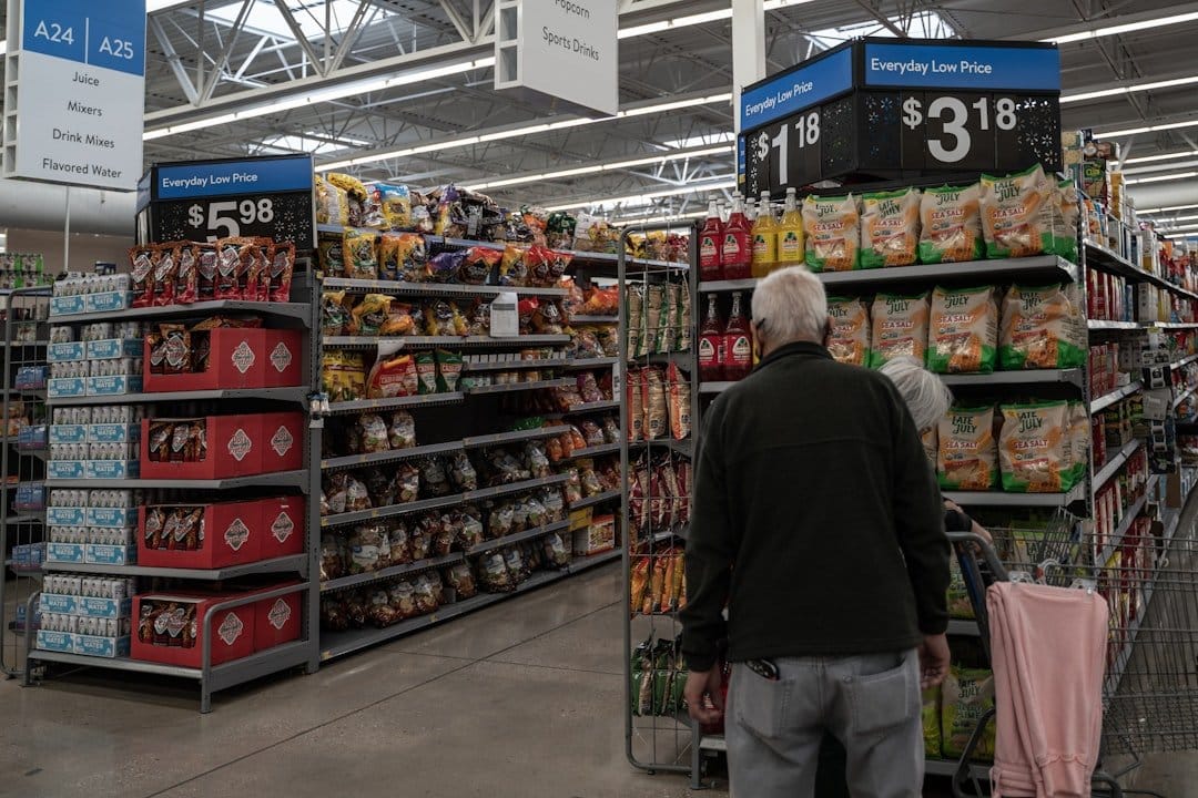 Shopper browsing retail store aisles with everyday low prices, eCommerce news on Walmart's collectibles market expansion